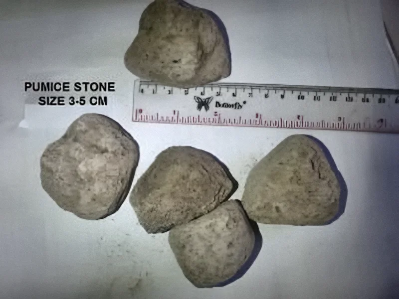 Pumice stone, 3-5 cm grade next to a ruler